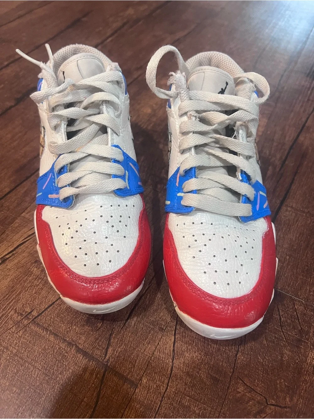 Nike Kids White Sneakers with Red & Blue Accents